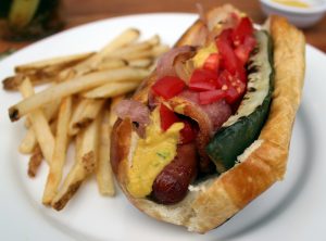 Bacon wrapped hot dog with grilled pickle